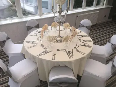 a white table with white chairs around it at Dryfesdale Hotel - BW Signature Collection in Lockerbie