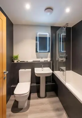 a bathroom with a toilet and a sink at *Luxury Apartment 2min from City in Carlisle