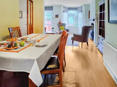 a kitchen and dining room with a table and chairs at Little Hills in Keswick