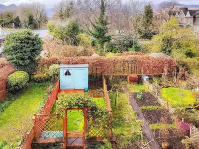 an overhead view of a garden with a blue shed at Little Hills in Keswick