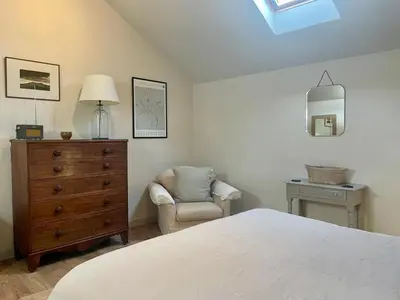 a bedroom with a bed and a chair and a dresser at 1 Bed in Watermillock 94068 in Watermillock