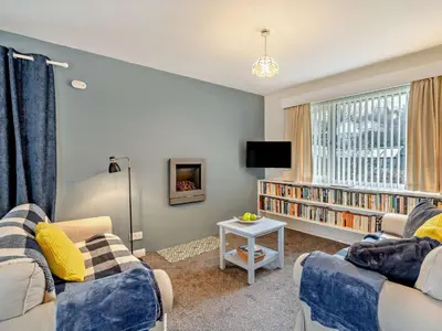 a living room with two couches and a tv at 1 Bed in Keswick oc-94245 in Keswick