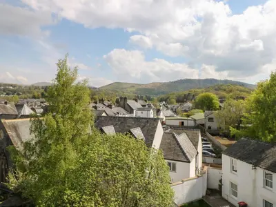a view of a town with houses and mountains at Baystones in Keswick
