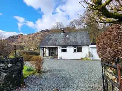 a white house with a fence and a driveway at Beckfoot Chapel Stile - Ambleside in Chapel Stile