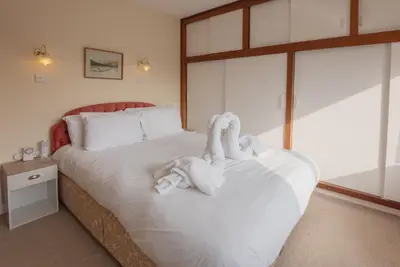 a bedroom with a bed with towels on it at Beckfoot Chapel Stile - Ambleside in Chapel Stile