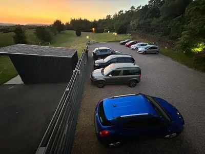 a group of cars parked in a parking lot at Southpark House in Dumfries