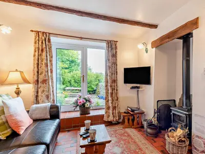 a living room with a couch and a window at 1 Bed in Eskdale 94530 in Eskdale