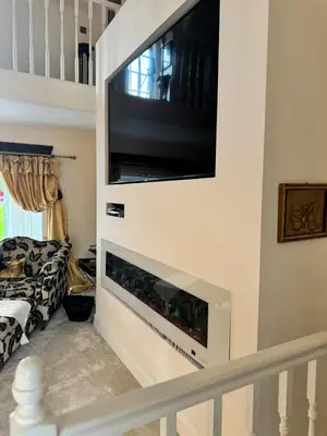 a flat screen tv on a wall in a living room at WestLaigh Lrg Luxury Country Farm House 20 min from the city in Glassford