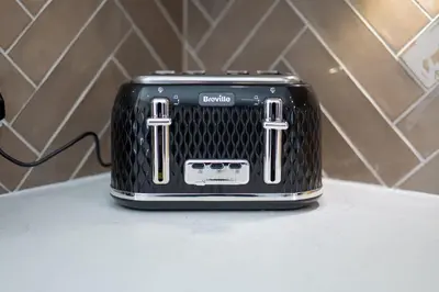 a black toaster sitting on top of a counter at South Beach View in Troon