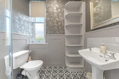 a bathroom with a toilet and a sink at Ashbrooke Apartment Keswick at The Lairbeck in Keswick