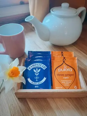 a box of three spices and a tea pot and a flower at The Duddon Nest in Ulpha