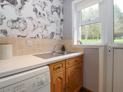 a kitchen with a sink and a window at Glen View in Dumfries