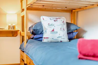 a bedroom with a bunk bed with a pillow on it at 2 Bed in Irthington oc-v28308 in Irthington