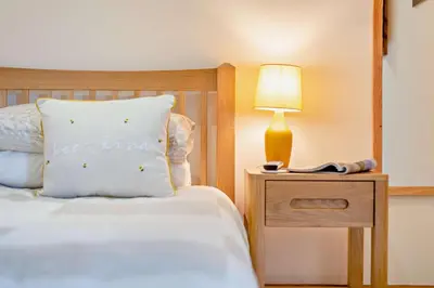 a bedroom with a bed and a lamp on a night stand at 2 Bed in Irthington oc-m28305 in Irthington