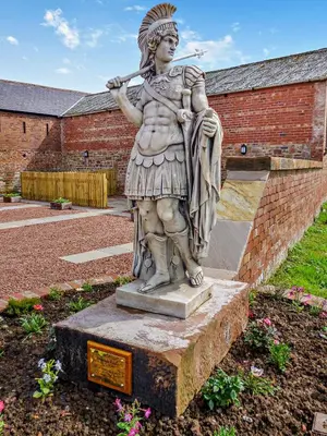 a statue of a woman holding a spear at 2 Bed in Irthington oc-m28305 in Irthington