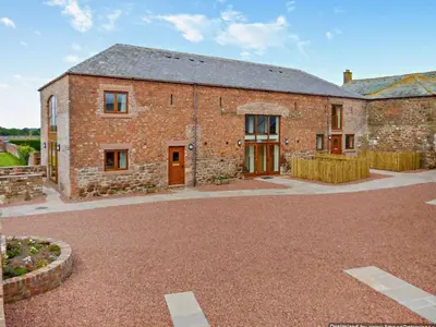 an old brick house with a gravel driveway at 2 Bed in Irthington oc-m28305 in Irthington