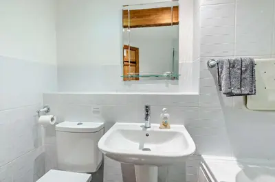 a white bathroom with a toilet and a sink at 2 Bed in Irthington oc-m28305 in Irthington