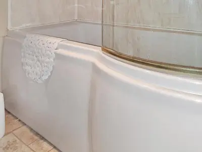a white bath tub in a bathroom at Forrest Lodge in Plumbland