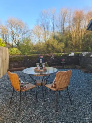 a table and two chairs and a table and a table and chairs at The Nest by Blake view holidays, a peaceful boutique retreat, 3 miles from Ennerdale- small twin or king bed available in Rowrah