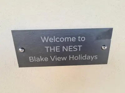 a sign that reads welcome to the nest blake view holidays at The Nest by Blake view holidays, a peaceful boutique retreat, 3 miles from Ennerdale- small twin or king bed available in Rowrah