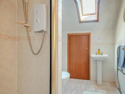 a bathroom with a shower and a toilet and a sink at Barnstable - Uk46888 in Kilmory