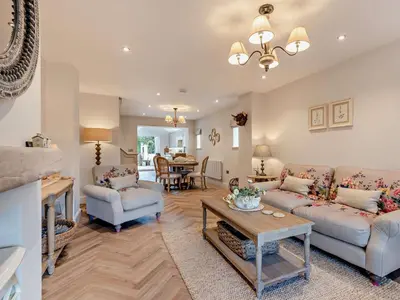 a living room with two couches and a table at 2 Bed in Cockermouth 94787 in Broughton Moor