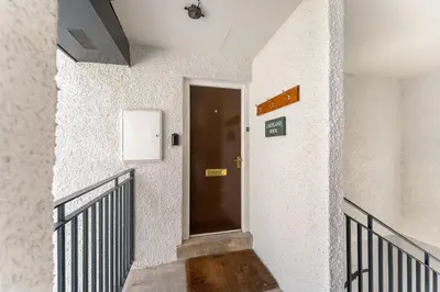 a stairway with a door in a building at Lakeland Nook in Keswick