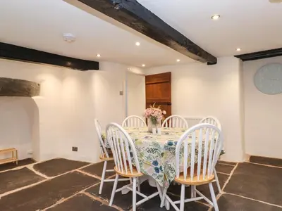 a dining room with a table and chairs at One Side House Farm in Ambleside
