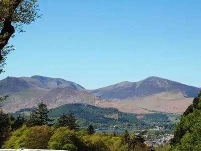 a view of a valley with mountains in the background at Bramble Cottage perfect for a relaxing romantic break in Keswick in Keswick