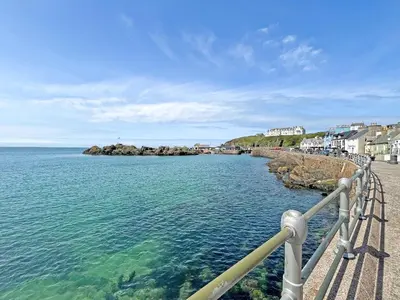 a view of the ocean from a pier at Driftwood Cottage in Portpatrick
