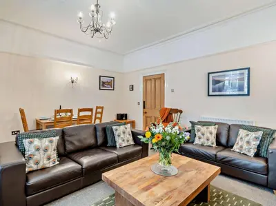 a living room with a couch and a table at 2 Bed in Keswick oc-94995 in Keswick