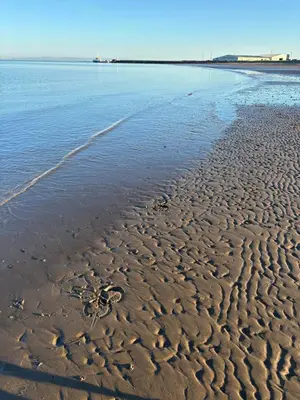a sandy beach with footprints in the sand at No 6, Ayr, 140m2, New Decor 2024, 3bedroom, detached house, with private gardens in Ayr