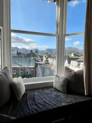 a large window with a view of a city at Shemara rooms in Keswick