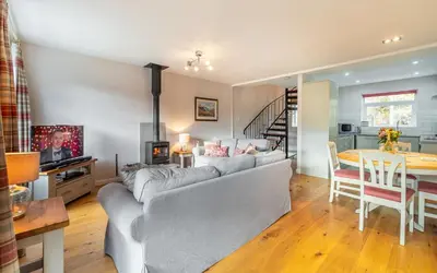 a living room with a couch and a table at Number One in Chapel Stile