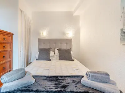 a bedroom with a large bed with two pillows at Carraig-Dhubh South - Uk47124 in Whiting Bay