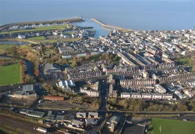 an aerial view of a city with a harbor at The Penthouse - Crosby St 2 Bed in Maryport