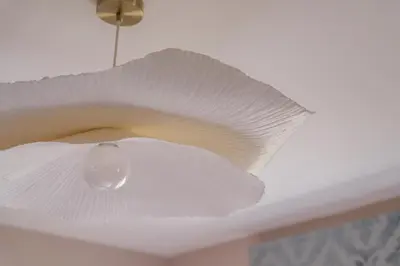 a white ceiling fan with a white paper shade at Oakbank-Central Grasmere in Grasmere