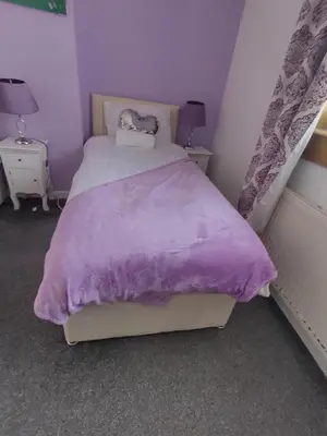 a purple bedroom with a bed with a purple blanket at Kumba in Kilmarnock