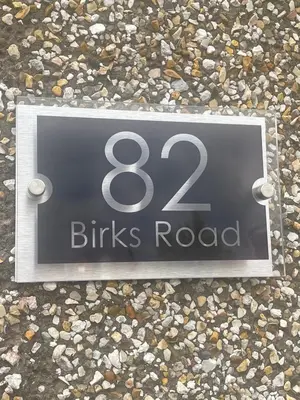a street sign that reads drinks road on rocks at Birks road in Cleator Moor