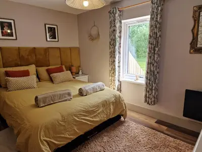 a bedroom with a bed and a window at The Drey by Blake view holidays, a peaceful boutique retreat, 3 miles from Ennerdale- small twin or king bed available in Arlecdon