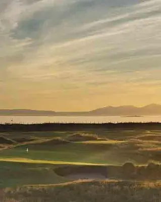 a view of a golf course at sunset at DeiRa Hotel & Apartments in Prestwick