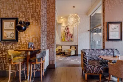 a dining room with a table and chairs at Inn on the Square in Keswick
