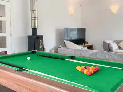 a living room with a pool table with balls on it at Bengali in Ringford