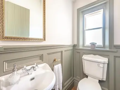 a bathroom with a sink and a toilet at The Coach House in Longtown
