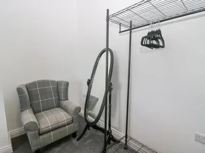 a room with a chair and a hula hoop at Victroneen Cottage in Whitehaven