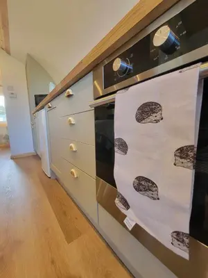 a kitchen with an oven with cookies on it at The Galloway Steading -The Hedgehog's Hideout family cabin with Hot Tub and Fire Pit in Glenluce