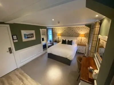 a bedroom with a large bed in a room at The Inn At Grasmere in Grasmere