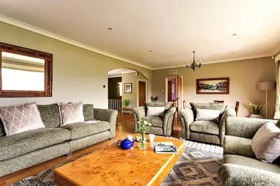 a living room with couches and a coffee table at Finest Retreats - Unerigg in Grasmere