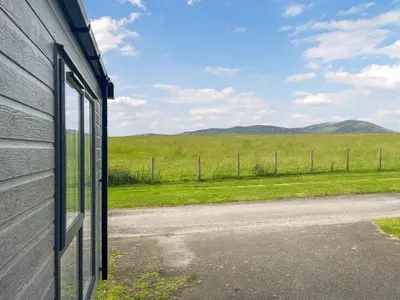 a view of a field from the side of a house at Uk47534 - Sea View 82 in Mainsriddle