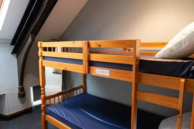 a couple of bunk beds in a room at Weirside, Chapel Stile in Ambleside